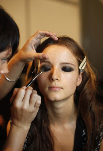 makeup model. model-getting-her-makeup-done-