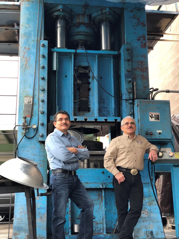 Saul and Juan Estrada left to right at 350-ton hydraulic press. Photo Saul Estrada Jr_.jpg