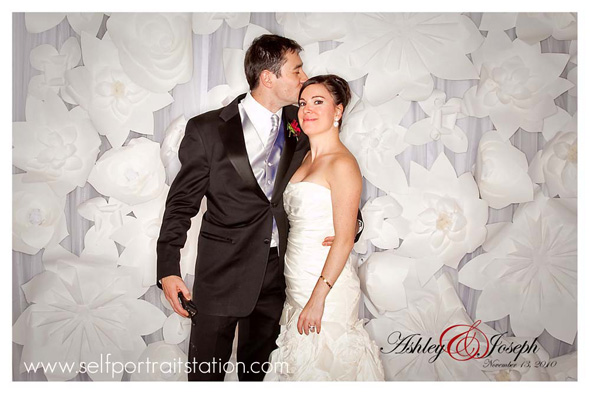 We love the modern white paper flowers for the backdrop of this portrait 