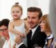 David Beckham sitting front row at a fashion show with daughter Harper and Anna Wintour