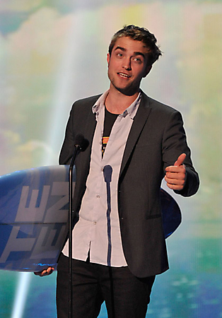 Actor Robert Pattinson speaks onstage.