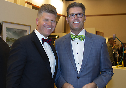 Auctioneer Bobby Elhert and supporter Greg Molotky