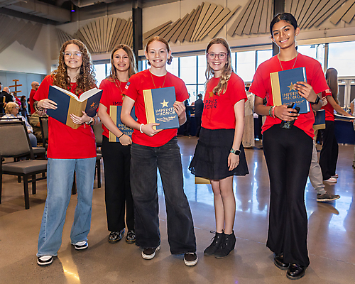Students holding books