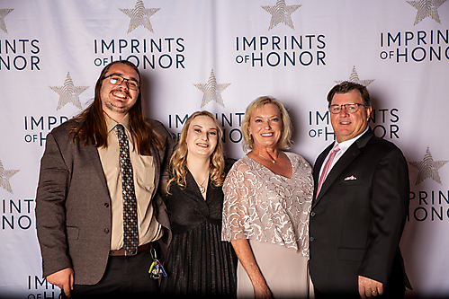 Karissa Wenzel with her husband Jake, and parents, Shelly and Justin Frank