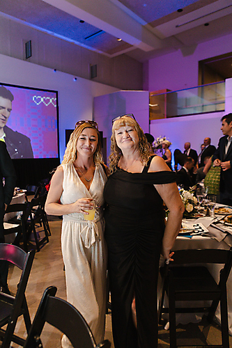 on right Donna Close Presenting Sponsor Representative American Roofing & Waterproofing