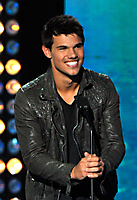 Actor Taylor Lautner speaks onstage.