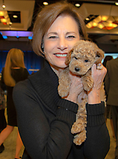 Event Director Judy Shannon with Goldendoodle up for bid