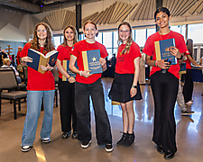 Students holding books
