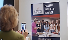 Guest taking photo of banners