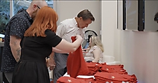 Guests selecting logo polo shirts