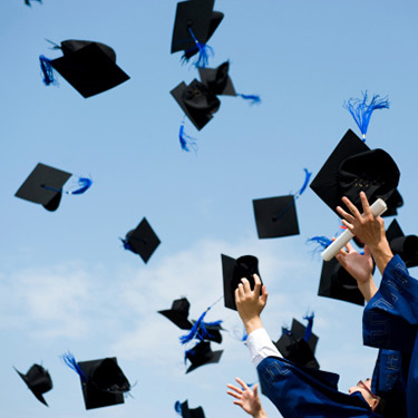 graduation-caps-being-thrown_web.jpg